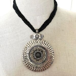 Silver tone large circle multi strand pendant necklace